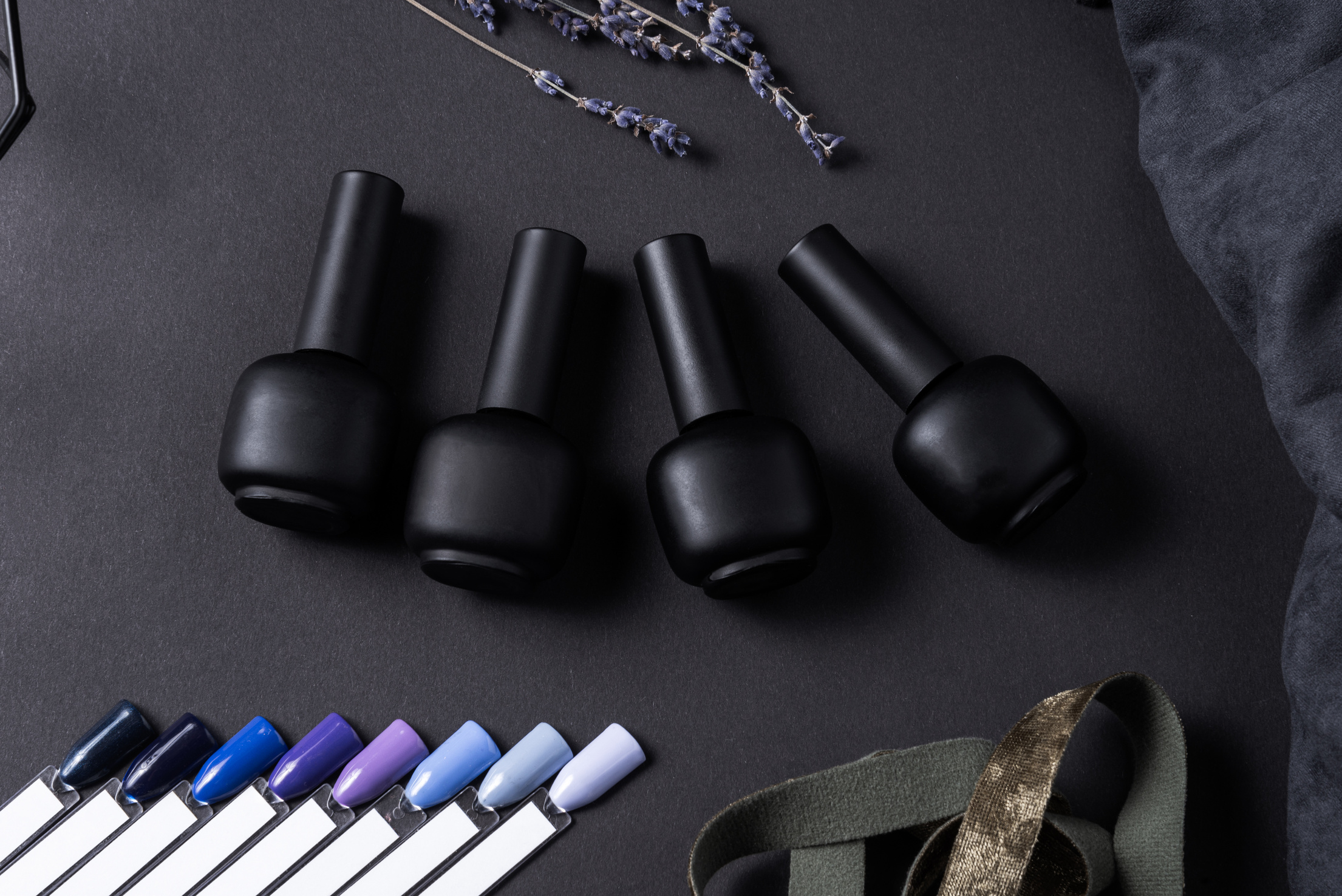 setof gel nail polish on black background with tips